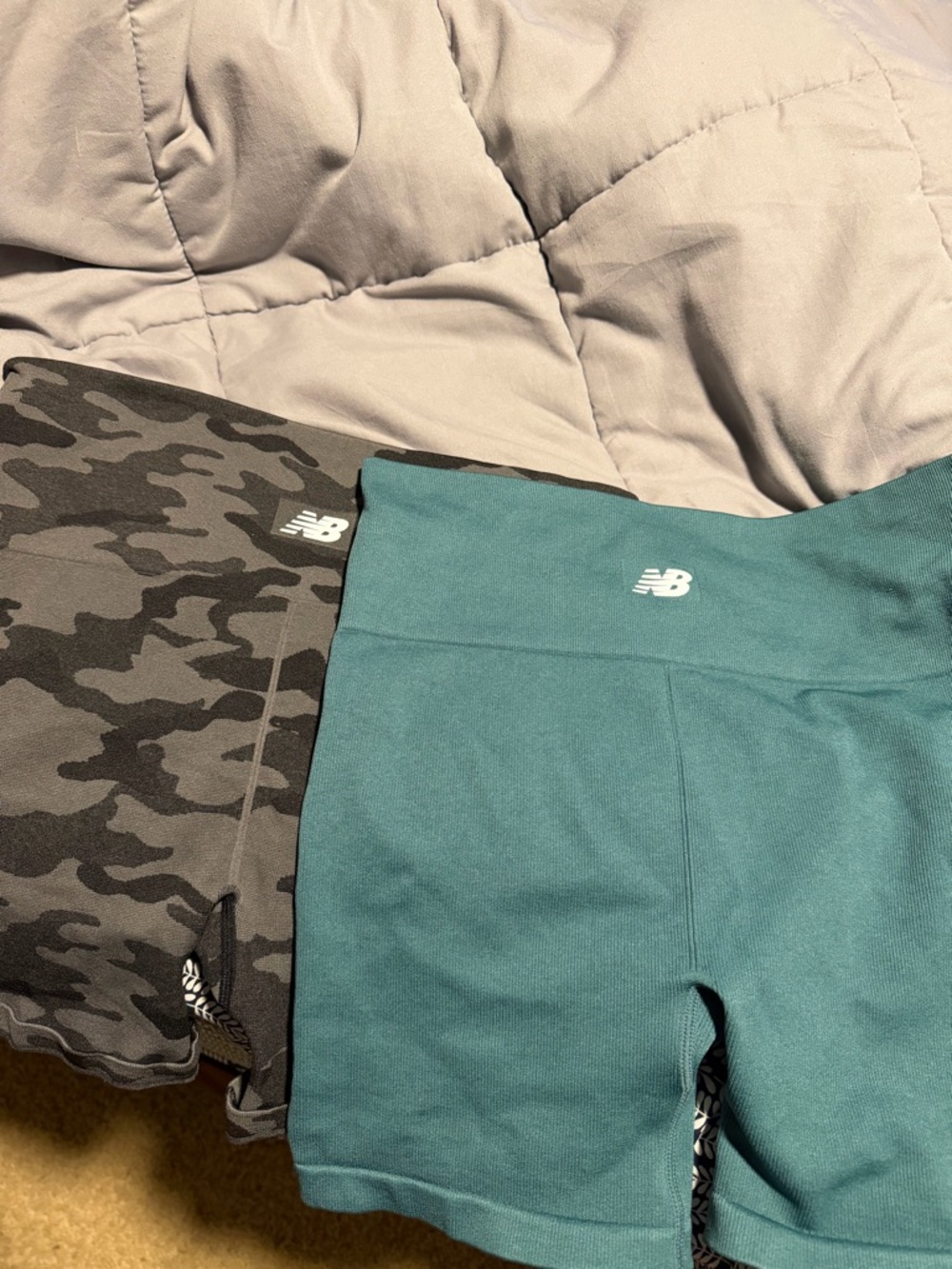 New Balance Teal Kids' Athletic Shorts with Black Camouflage Pair